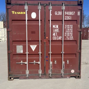 20' standard used storage container in red, front view with doors